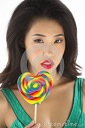 Asian Girl with colorful lollipop Stock Photo