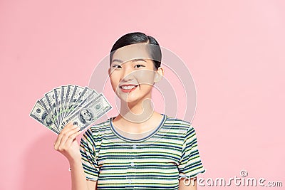 Asian girl counting salary dollar note. Success wealth financial business cashflow currency bill payment concept Stock Photo