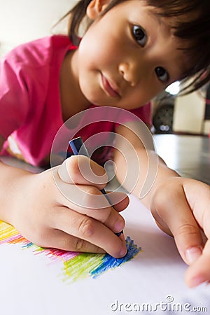 Asian girl drawing a picture. Stock Photo