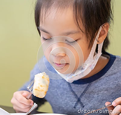 Asian girl eating in chinese restuarant Stock Photo