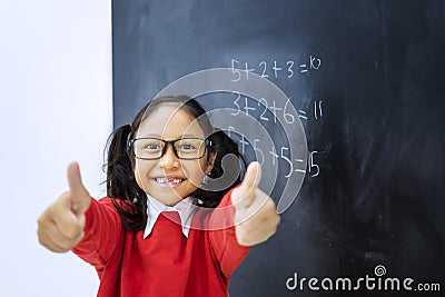 Asian girl finished addition calculations Stock Photo