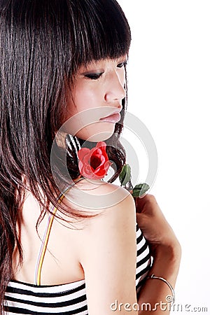 Asian girl holds a rose Stock Photo