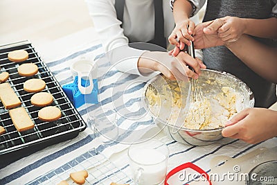 Asian Girl, Kid and young woman are preparing the dough. Stock Photo