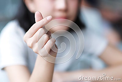 Asian girl make Korean symbol hand heart Stock Photo