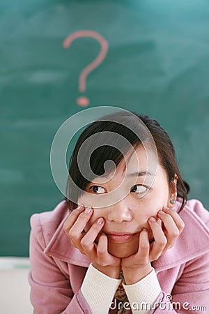 Asian girl with a red question mark Stock Photo