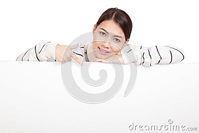 Asian girl with scarf point down , rest her chin on blank sign Stock Photo