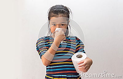 Asian girl sick with sneezing on nose and cold cough on tissue paper Stock Photo