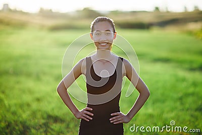 Asian girl in sportswear running across field, morning workout Stock Photo