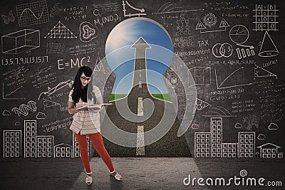 Asian girl study in front of keyhole success road Stock Photo