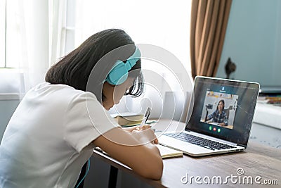 Asian girl studying homework online lesson at home Stock Photo