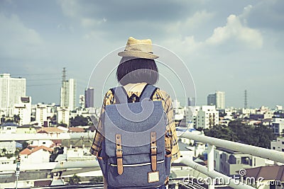 Asian girl tourists stand to admire the beauty of the building. and landscape of Bangkok, Thailand. during his vacation trip Stock Photo