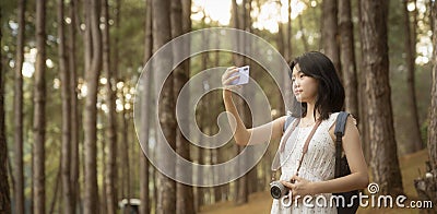 Asian girl travel and walk on the bridge at Pang umg park Stock Photo