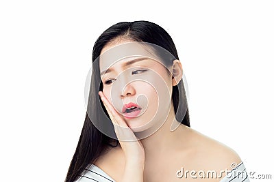 Asian girl in white casual dress Show off the toothache, Maybe because of not maintaining good oral health. Stock Photo
