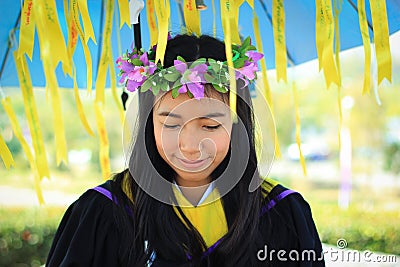 Asian graduated girl hold umbrella Stock Photo