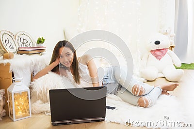 Asian gril relax in living room Stock Photo