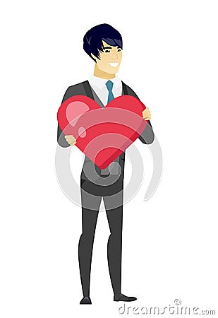 Asian groom holding a big red heart. Vector Illustration