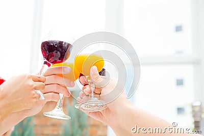 Asian group people drinking at party outdoor. group of friends cocktails in hand with glasses. Stock Photo