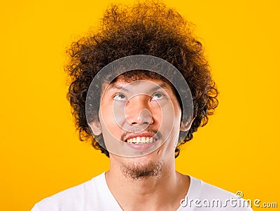 Asian handsome man with curly hair looking up see he hair isolate Stock Photo