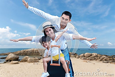 Asian happy family have fun on the beach. Traveling backpack for travel in vocations for leisure and destination. Stock Photo