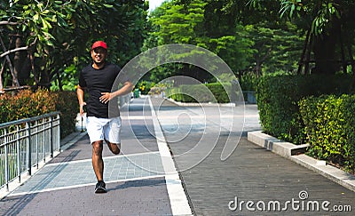 Healthy runner jogging outdoor. Fitness and sport healthy lifestyle concept. Stock Photo