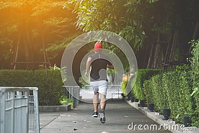 Healthy runner jogging outdoor. Fitness and sport healthy lifestyle concept. Stock Photo