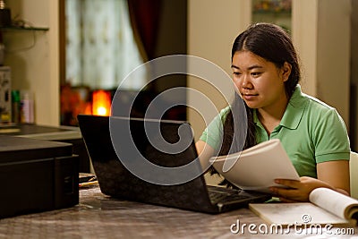 Asian high school girl learning through online class Stock Photo