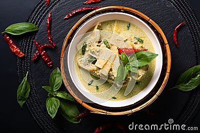 Asian home cooking Concept Thai chicken and baby bamboo Green curry on black background with copy space Stock Photo