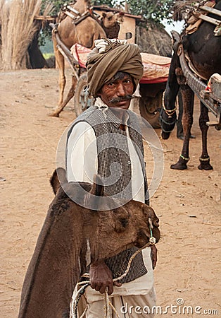 Asian Indian man Camel Driver With Animal Editorial Stock Photo