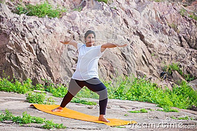 Asian Indian Woman doing yoga stretching exercise outdoor, body Fitness and health concept Editorial Stock Photo