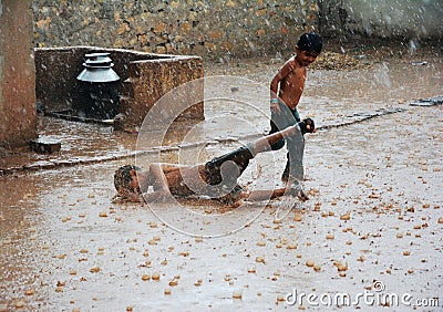 Kids in Heavy Rain Editorial Stock Photo