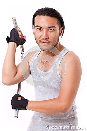 Asian Kung Fu man with chainsticks Stock Photo