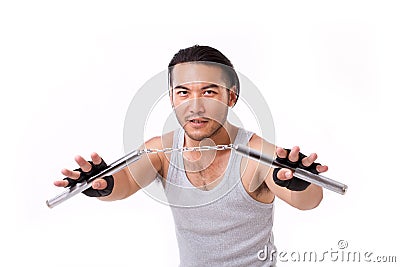 Asian Kung Fu man with chainsticks or nunchaku Stock Photo