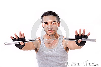 Asian Kung Fu man with chainsticks or nunchaku Stock Photo