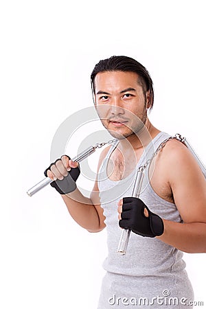 Asian Kung Fu man with chainsticks or nunchaku Stock Photo