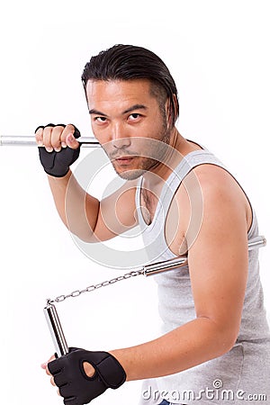 Asian Kung Fu man with chainsticks or nunchaku Stock Photo