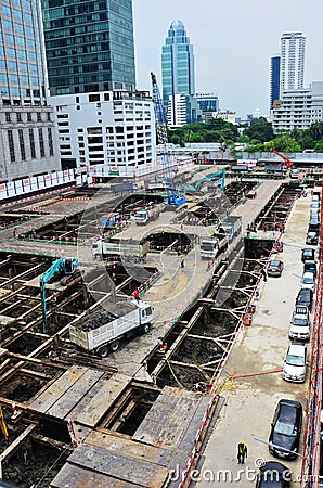 Asian labor people and thai labour worker use machine and heavy machinery working builder railway track electric sky train at Editorial Stock Photo