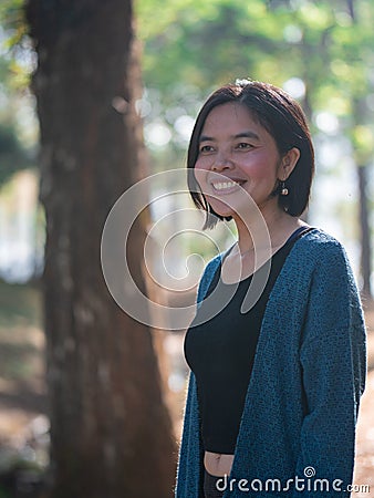 Asian lady in the forest Stock Photo