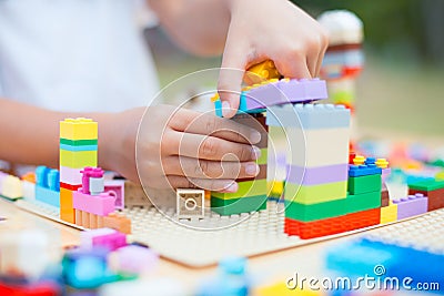 Asian little child girl hand playing with colorful toy blocks Stock Photo