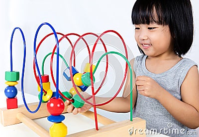 Asian Little Chinese Girl Playing Colorful Educational Toy Stock Photo