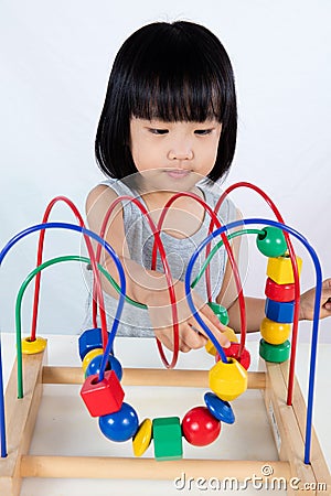 Asian Little Chinese Girl Playing Colorful Educational Toy Stock Photo