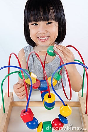 Asian Little Chinese Girl Playing Colorful Educational Toy Stock Photo