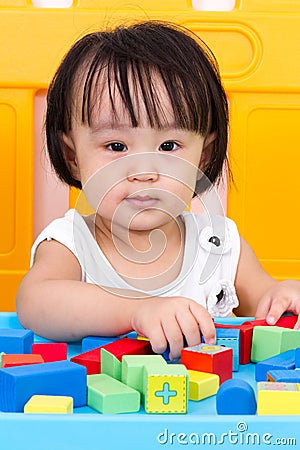 Asian Little Chinese Girl Playing Wooden Blocks Stock Photo