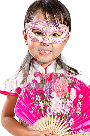 Asian Little Chinese Girl Wearing Mask and Holding Oriental Fan Stock Photo