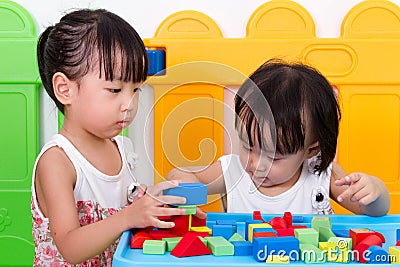 Asian Little Chinese Girls Playing Wooden Blocks Stock Photo