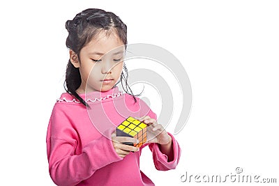 Asian little clever girl solve puzzle Editorial Stock Photo