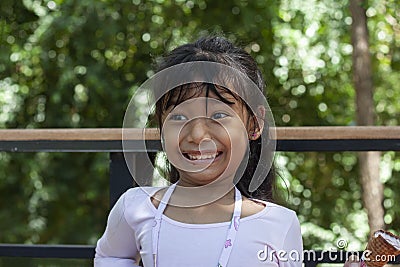 Asian little girl eating ice cream with deliciousness on summer. Stock Photo