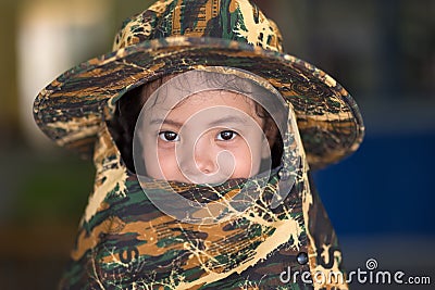 Asian little girl portrait with camo hat Editorial Stock Photo