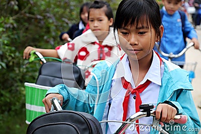 Asian little girl ride cycle from school Editorial Stock Photo