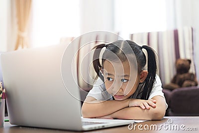 Asian little girl student learning virtual internet online Stock Photo