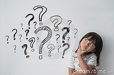 Asian little girl thinking with question mark Stock Photo